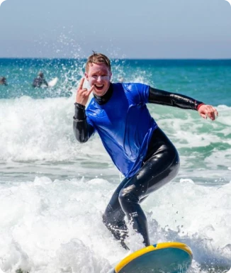 Happy surfer riding a wave